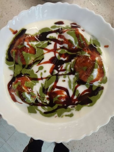 Tasty Dahi Vada cooked by COOX chefs cooks during occasions parties events at home