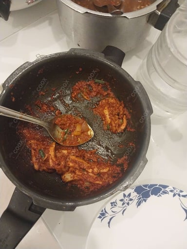 Tasty Chicken In Burnt Garlic Sauce cooked by COOX chefs cooks during occasions parties events at home