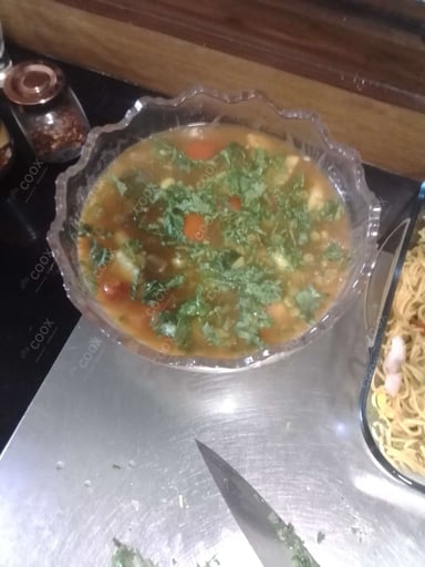 Tasty Mix Veg in Schezwan Sauce cooked by COOX chefs cooks during occasions parties events at home