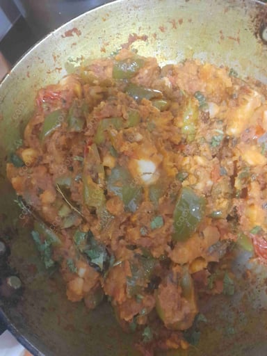 Tasty Bharwa Shimla Mirch cooked by COOX chefs cooks during occasions parties events at home