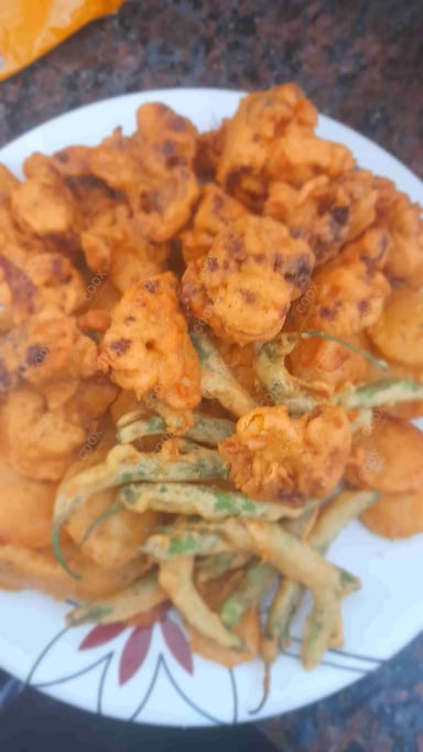 Tasty Mix Pakode cooked by COOX chefs cooks during occasions parties events at home