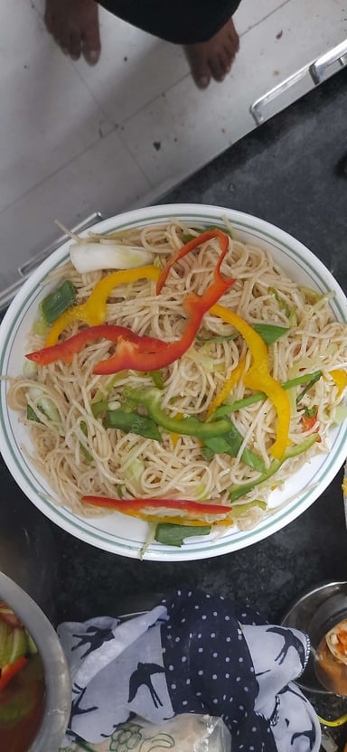 Tasty Veg Hakka Noodles cooked by COOX chefs cooks during occasions parties events at home