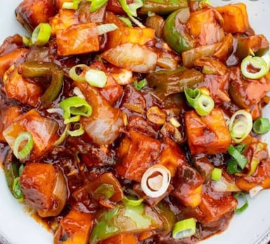 Tasty Chilli Paneer (Dry) cooked by COOX chefs cooks during occasions parties events at home