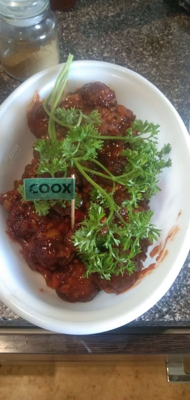 Tasty Veg Manchurian (Dry) cooked by COOX chefs cooks during occasions parties events at home