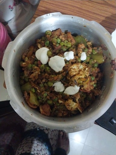 Tasty Gobhi Matar cooked by COOX chefs cooks during occasions parties events at home