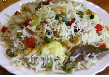 Tasty Veg Pulao cooked by COOX chefs cooks during occasions parties events at home