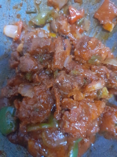 Tasty Chicken In Burnt Garlic Sauce cooked by COOX chefs cooks during occasions parties events at home
