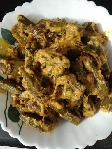 Tasty Bhindi cooked by COOX chefs cooks during occasions parties events at home