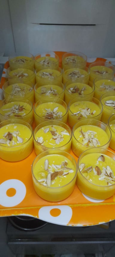 Tasty Mango Phirni cooked by COOX chefs cooks during occasions parties events at home