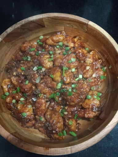 Tasty Chicken Manchurian (Dry) cooked by COOX chefs cooks during occasions parties events at home