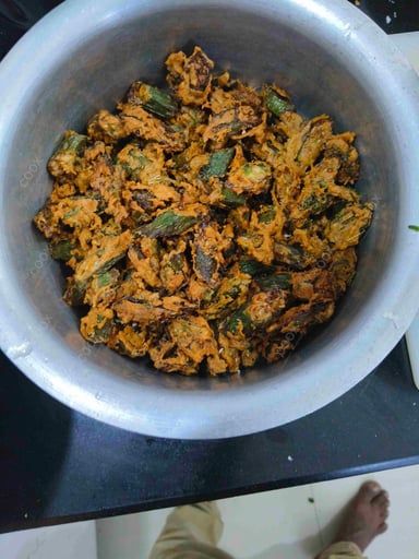 Tasty Bhindi do Pyaza cooked by COOX chefs cooks during occasions parties events at home