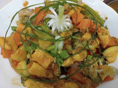 Tasty Mix Veg in Schezwan Sauce cooked by COOX chefs cooks during occasions parties events at home