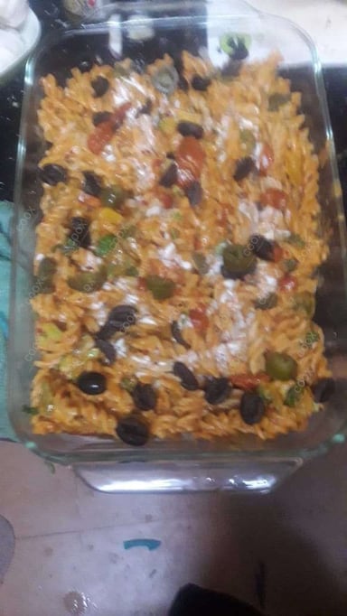 Tasty Pasta in White Sauce cooked by COOX chefs cooks during occasions parties events at home
