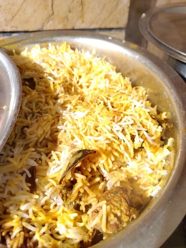 Tasty Mutton Biryani cooked by COOX chefs cooks during occasions parties events at home