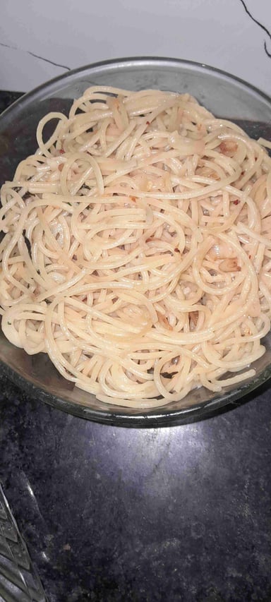 Tasty Spaghetti Aglio e Olio cooked by COOX chefs cooks during occasions parties events at home