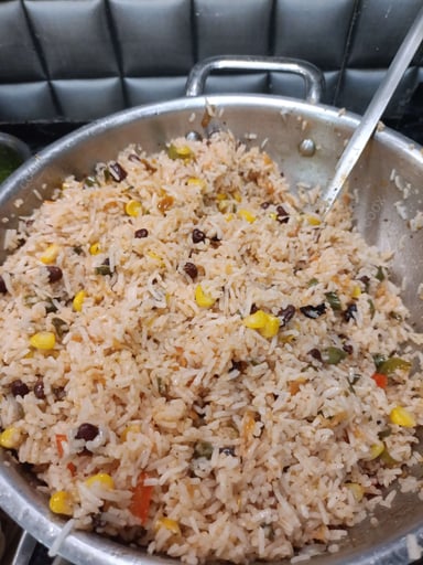 Tasty Mexican Rice cooked by COOX chefs cooks during occasions parties events at home