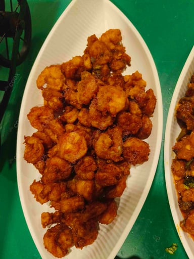 Tasty Medu Vada cooked by COOX chefs cooks during occasions parties events at home