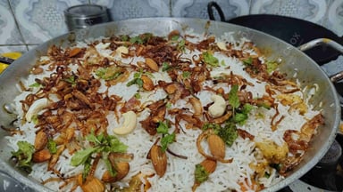 Tasty Veg Biryani cooked by COOX chefs cooks during occasions parties events at home