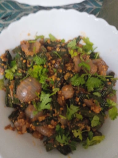 Tasty Bhindi do Pyaza cooked by COOX chefs cooks during occasions parties events at home