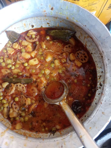 Tasty Aloo Matar cooked by COOX chefs cooks during occasions parties events at home