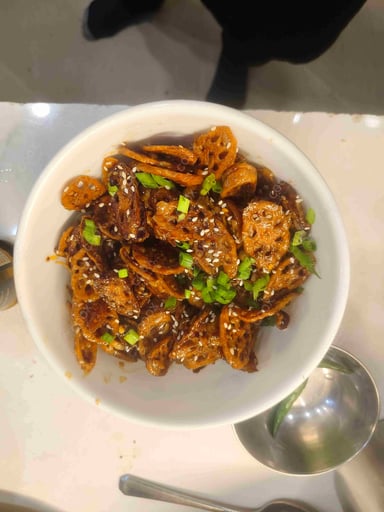 Tasty Chilli Lotus Stem cooked by COOX chefs cooks during occasions parties events at home