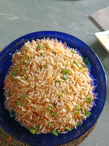 Tasty Schezwan Fried Rice cooked by COOX chefs cooks during occasions parties events at home