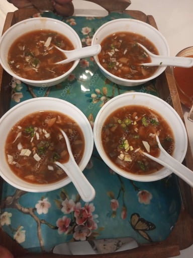 Tasty Hot & Sour Soup cooked by COOX chefs cooks during occasions parties events at home