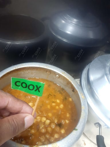 Tasty Kurkuri Bhindi cooked by COOX chefs cooks during occasions parties events at home