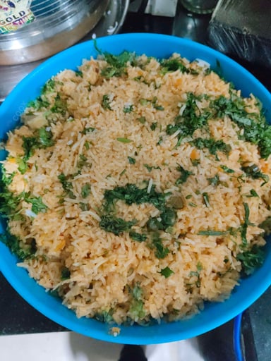 Tasty Schezwan Fried Rice cooked by COOX chefs cooks during occasions parties events at home
