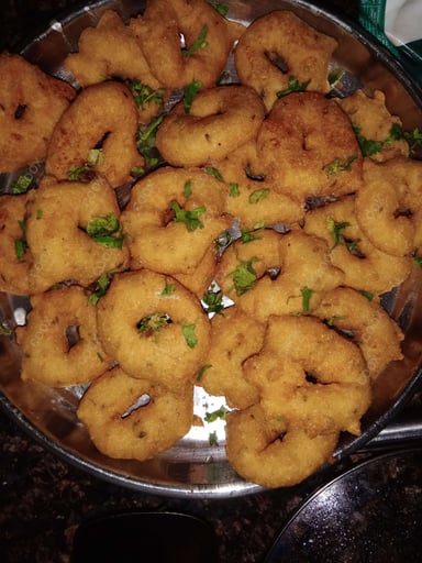 Tasty Medu Vada cooked by COOX chefs cooks during occasions parties events at home