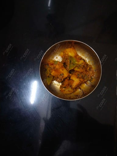 Tasty Aloo Shimla Mirch cooked by COOX chefs cooks during occasions parties events at home