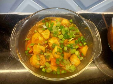 Tasty Chilli Paneer (Gravy) cooked by COOX chefs cooks during occasions parties events at home