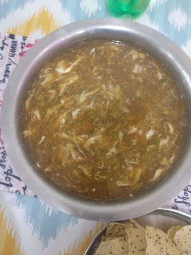 Tasty Chicken Manchow Soup cooked by COOX chefs cooks during occasions parties events at home