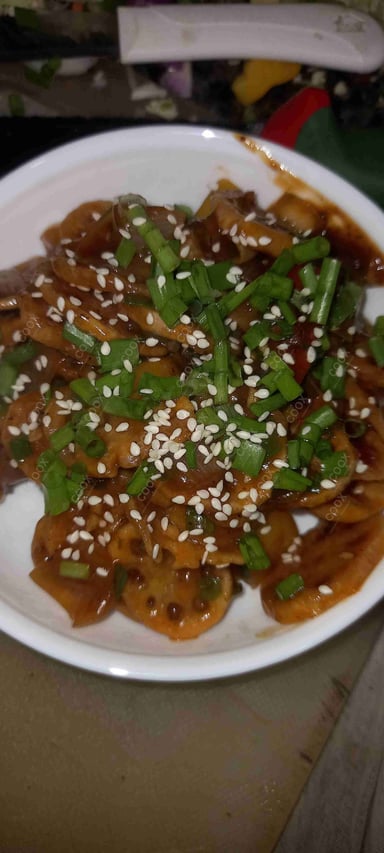 Tasty Chilli Lotus Stem cooked by COOX chefs cooks during occasions parties events at home