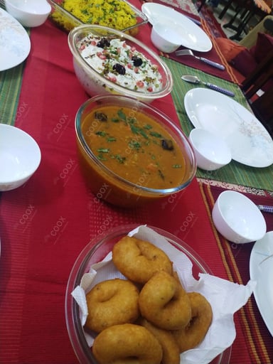 Tasty Medu Vada cooked by COOX chefs cooks during occasions parties events at home