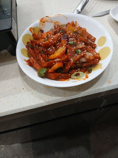 Tasty Chilli Lotus Stem cooked by COOX chefs cooks during occasions parties events at home