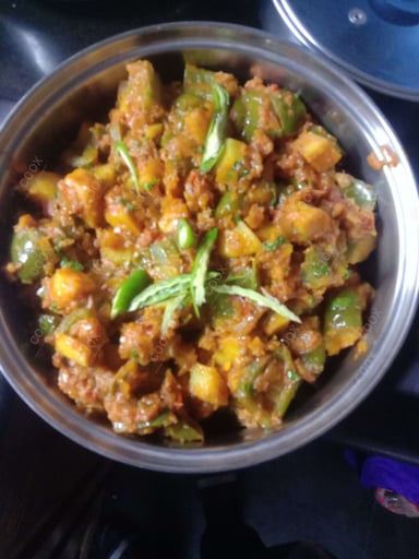 Tasty Aloo Shimla Mirch cooked by COOX chefs cooks during occasions parties events at home
