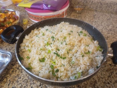 Tasty Burnt Garlic Rice cooked by COOX chefs cooks during occasions parties events at home