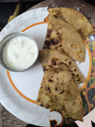 Tasty Stuffed Paranthas cooked by COOX chefs cooks during occasions parties events at home