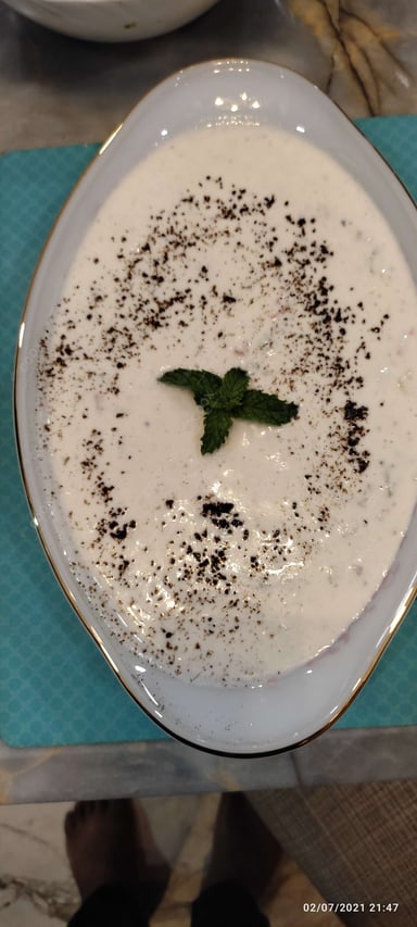 Tasty Plain Raita cooked by COOX chefs cooks during occasions parties events at home