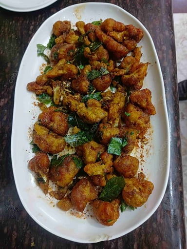 Tasty Gobhi 65 cooked by COOX chefs cooks during occasions parties events at home