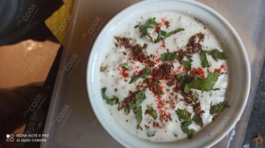 Tasty Plain Raita cooked by COOX chefs cooks during occasions parties events at home
