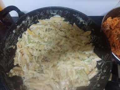 Tasty Pasta in White Sauce cooked by COOX chefs cooks during occasions parties events at home