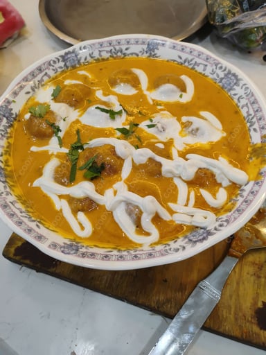 Tasty Malai Kofta (White Gravy) cooked by COOX chefs cooks during occasions parties events at home