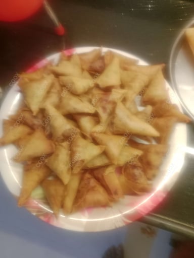 Tasty Keema Samosas cooked by COOX chefs cooks during occasions parties events at home