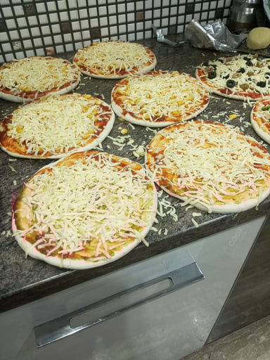 Tasty Margherita Pizza cooked by COOX chefs cooks during occasions parties events at home