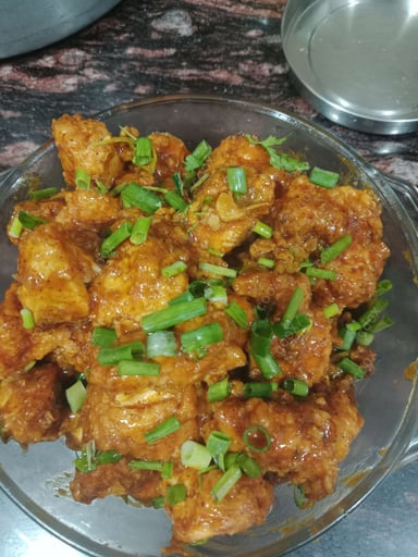 Tasty Chicken In Burnt Garlic Sauce cooked by COOX chefs cooks during occasions parties events at home