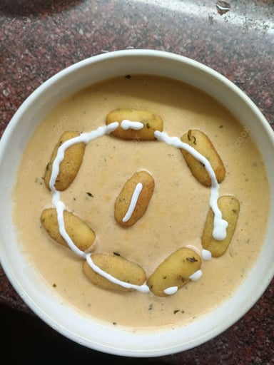 Tasty Malai Kofta (White Gravy) cooked by COOX chefs cooks during occasions parties events at home