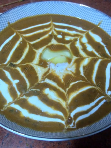 Tasty Dal Makhni cooked by COOX chefs cooks during occasions parties events at home