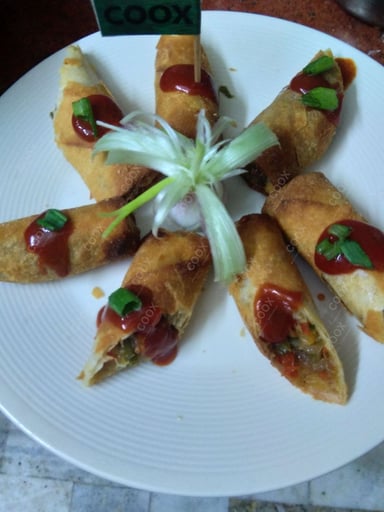 Tasty Veg Spring Rolls cooked by COOX chefs cooks during occasions parties events at home